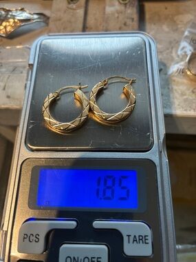 14K Gold Hoop Earrings with Chris-cross
Etching.   1.86 grams